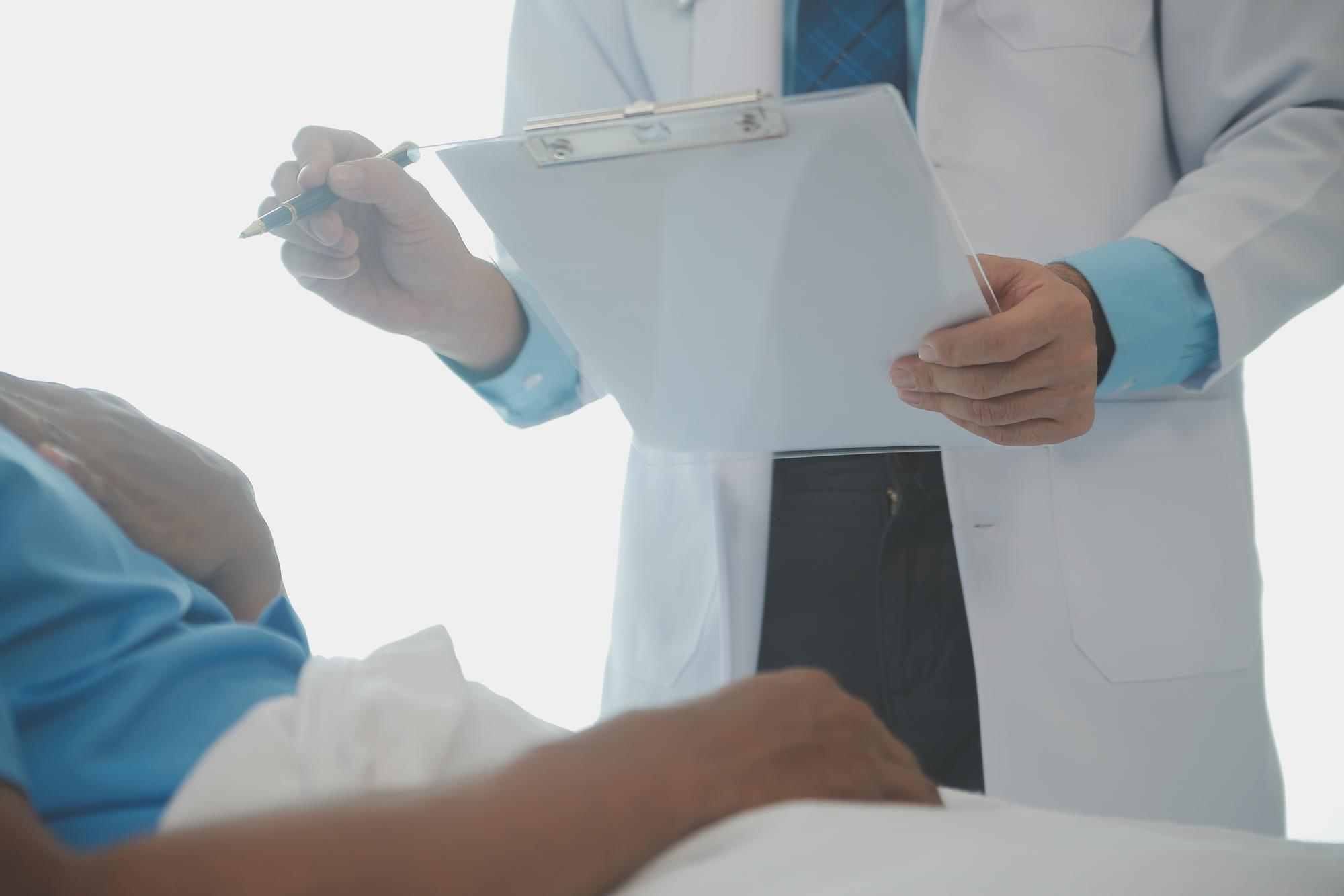 Doctor reviewing treatment notes with a patient