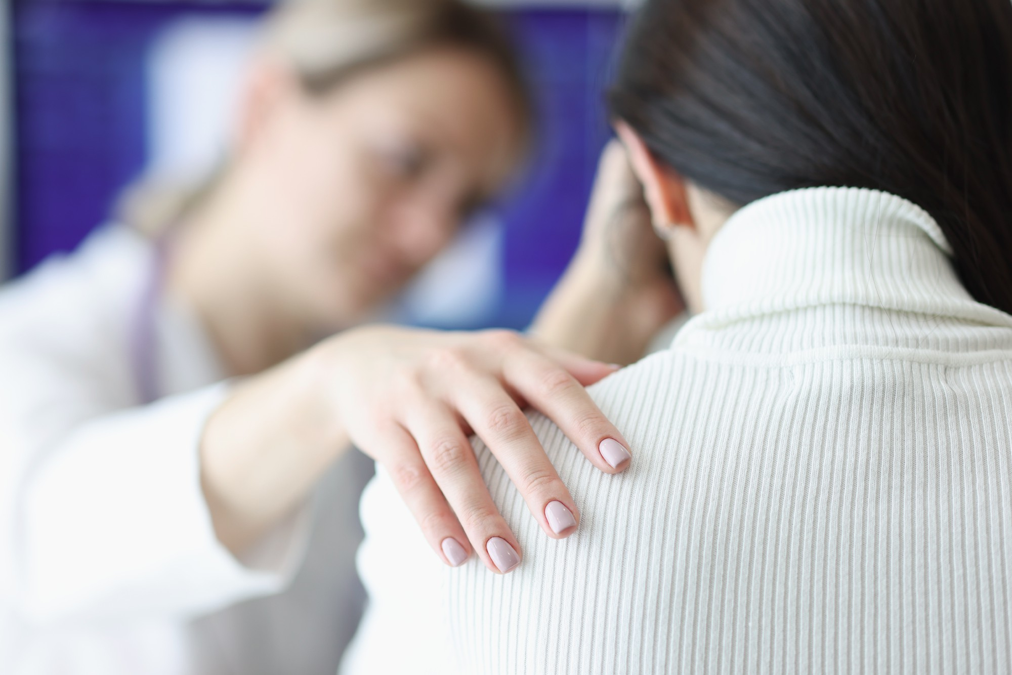 Clinician comforting a patient